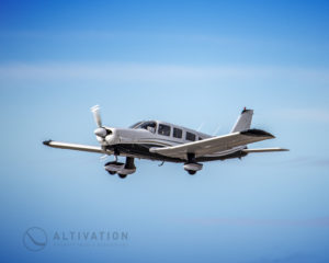 Piper Cherokee Six taking off into blue skies